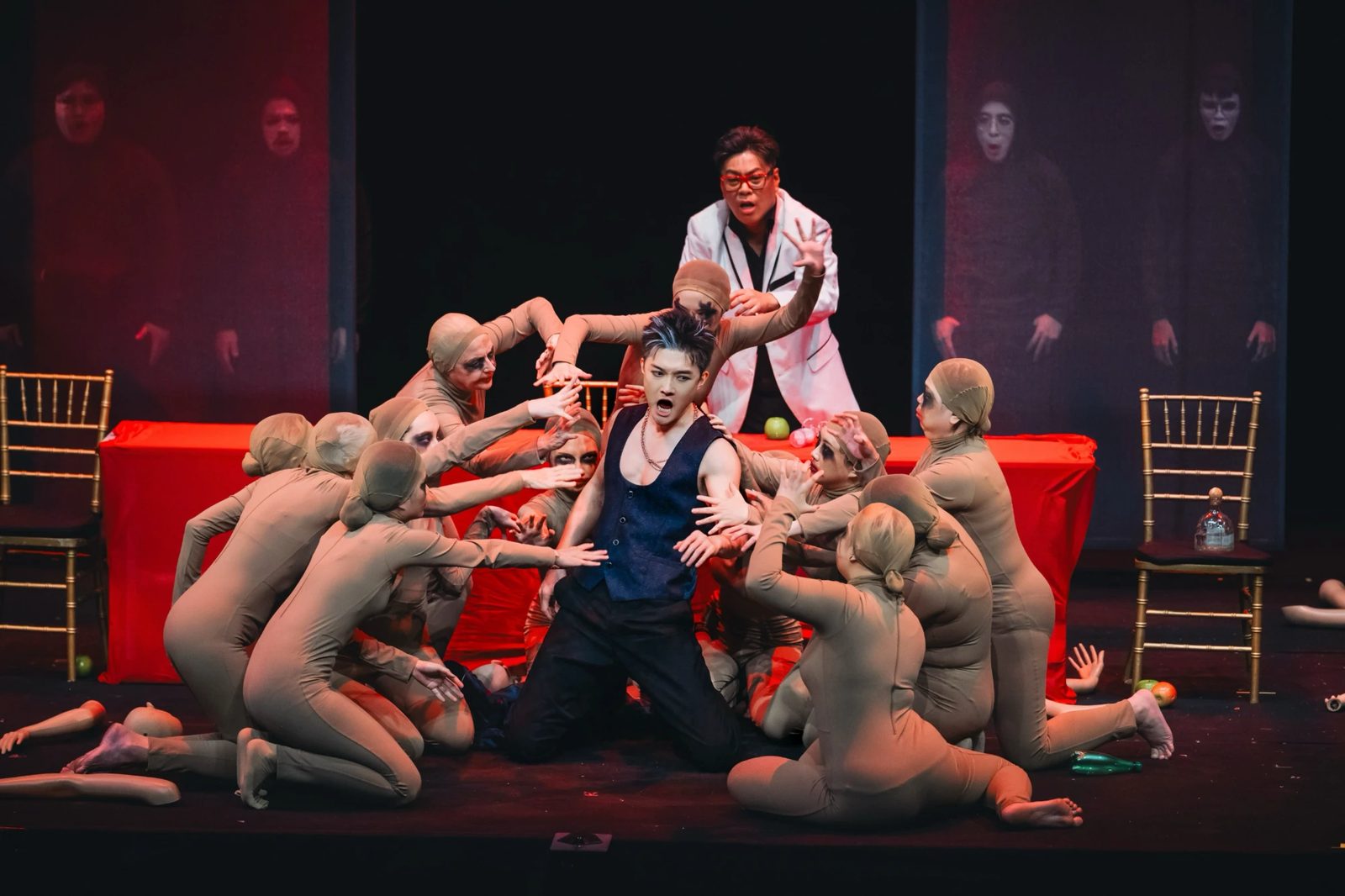 Don Giovanni surrounded by dancers at the banquet